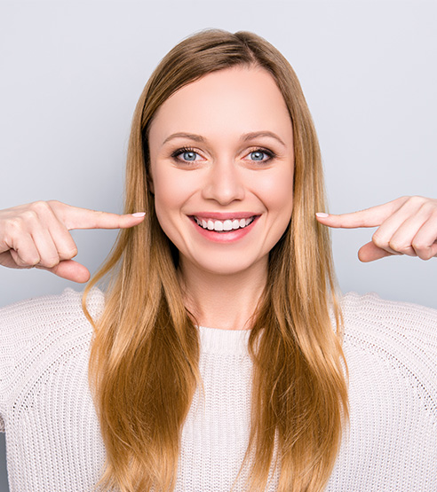 A young woman showing her smile off