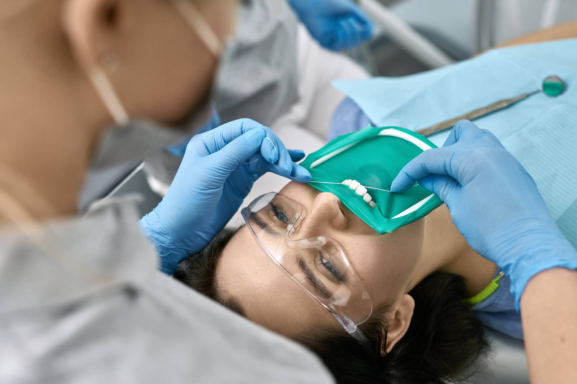 the flossing stage of citrus county family dental teeth cleaning